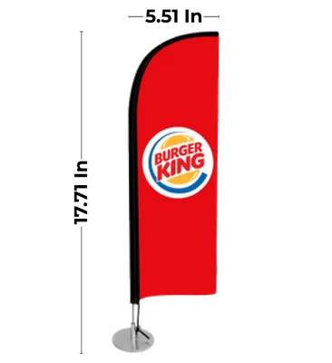 A red vertical trade show banner with the Burger King logo prominently displayed, mounted on a metal base and stand.